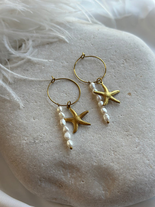 Pearl earrings with sea star